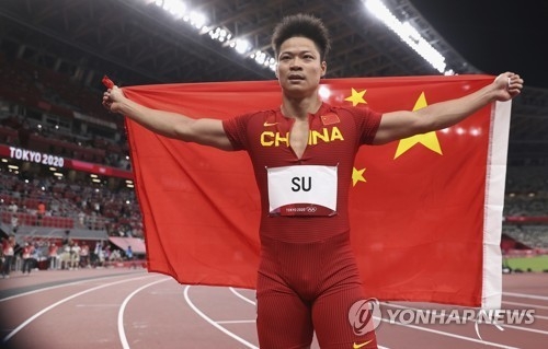 <strong>2021년 도쿄올림픽 남자 육상 100m 경기 후 포즈 취하는 쑤빙톈. 사진=연합뉴스/한중21 제휴사</strong>